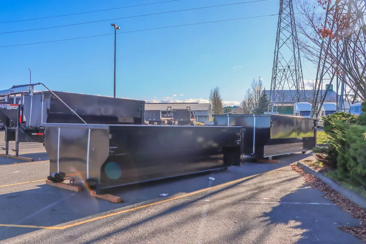 Roll-off dumpster ready for waste disposal at job site for 4 Yard Dumpster Rental in Avon